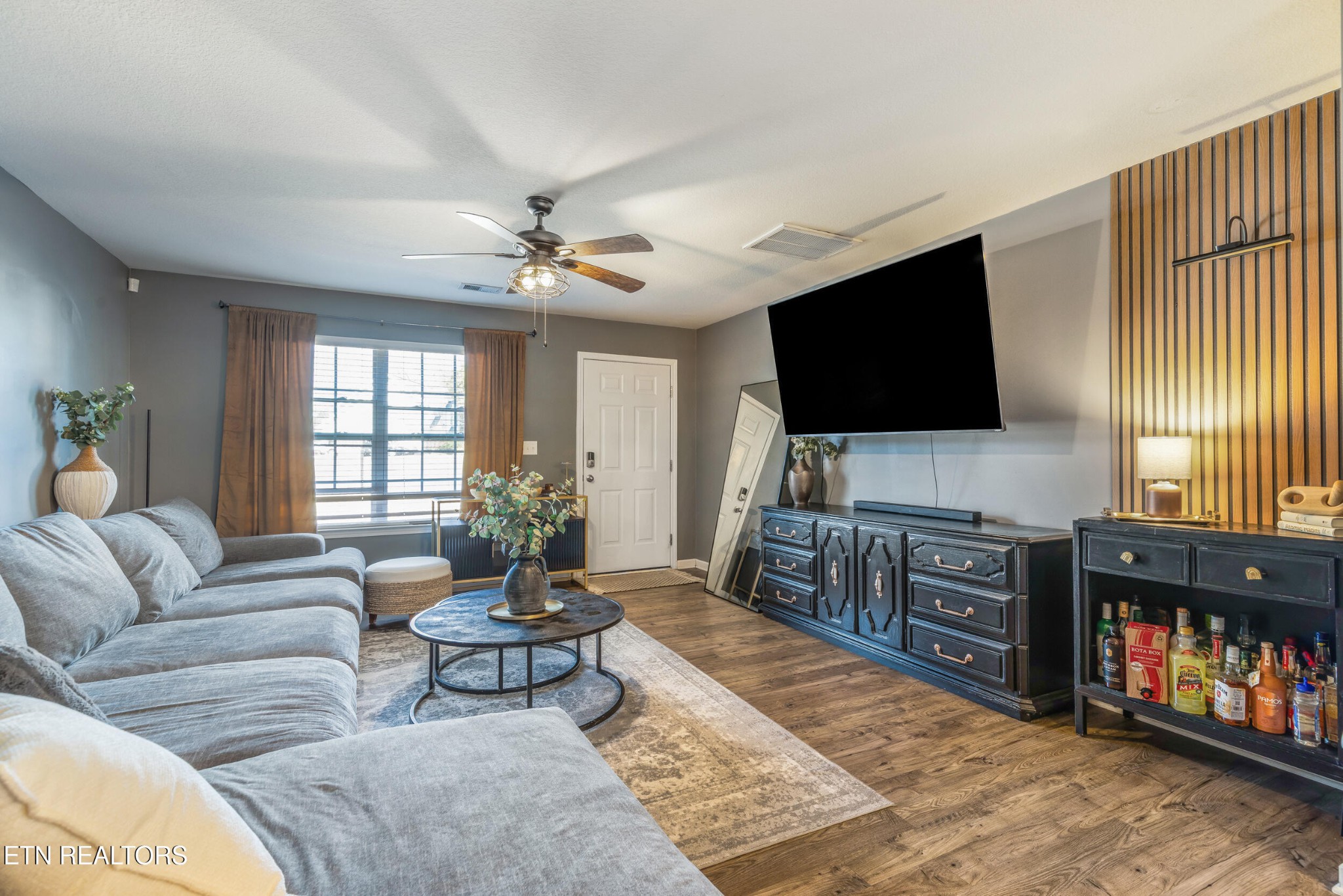 7200 Ponds Inlet Lane Powell, TN 37849 - Photo 3 of 38 a living room with furniture and a flat screen tv