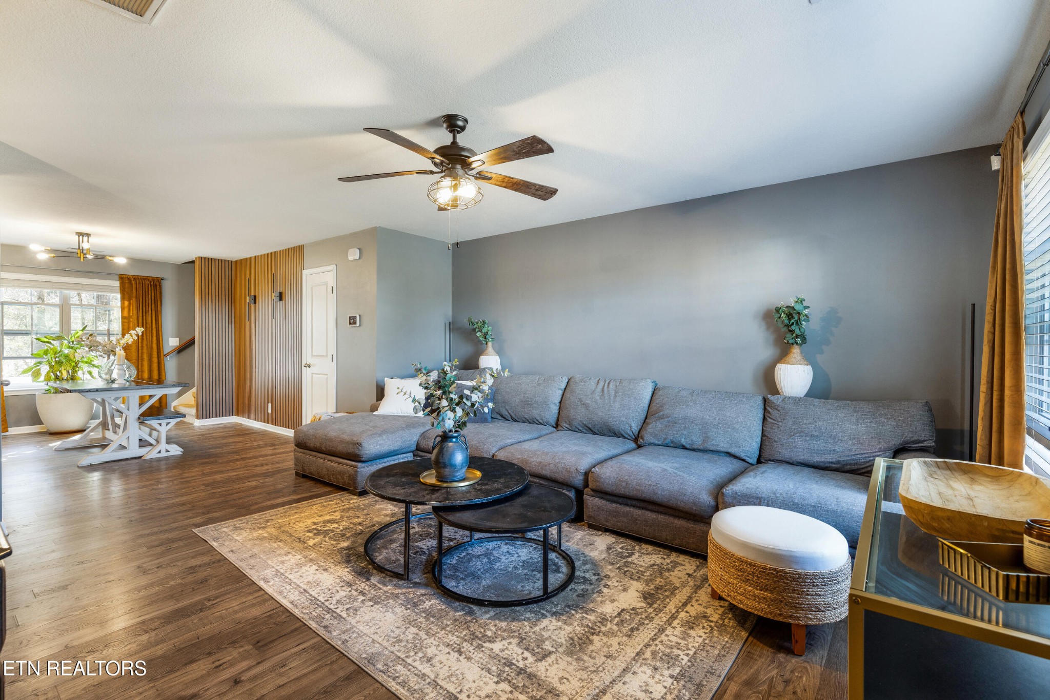 7200 Ponds Inlet Lane Powell, TN 37849 - Photo 4 of 38 a living room with furniture a rug and a chandelier