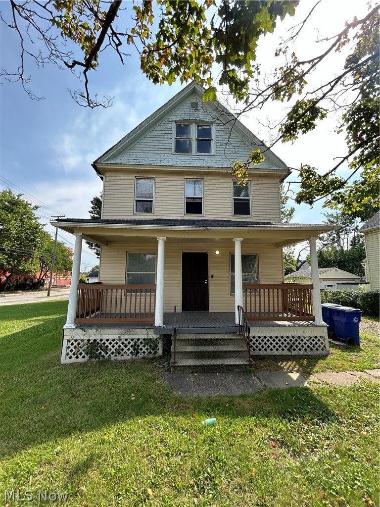 3403 Fulton Road, Unit DOWN Cleveland, OH 44109 - Photo 1 of 18 View of front of house with a porch and a front lawn