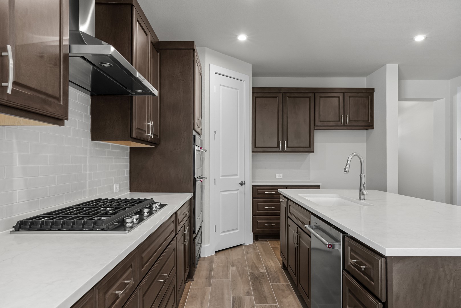 674 Iron Willow Loop Dripping Springs, TX 78620 - Photo 16 of 33 a kitchen with a sink a stove and cabinets