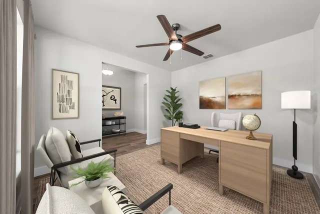 a living room with furniture and wooden floor