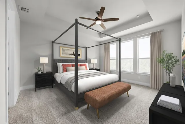 a bedroom with a bed couch and a window