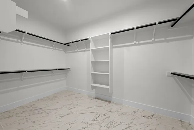 a view of an empty walk in closet
