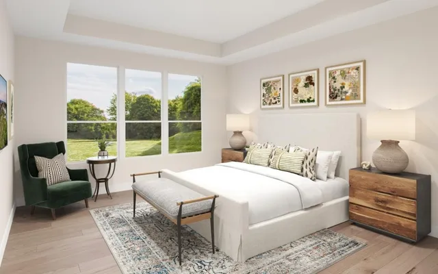 a bedroom with a large bed and a window