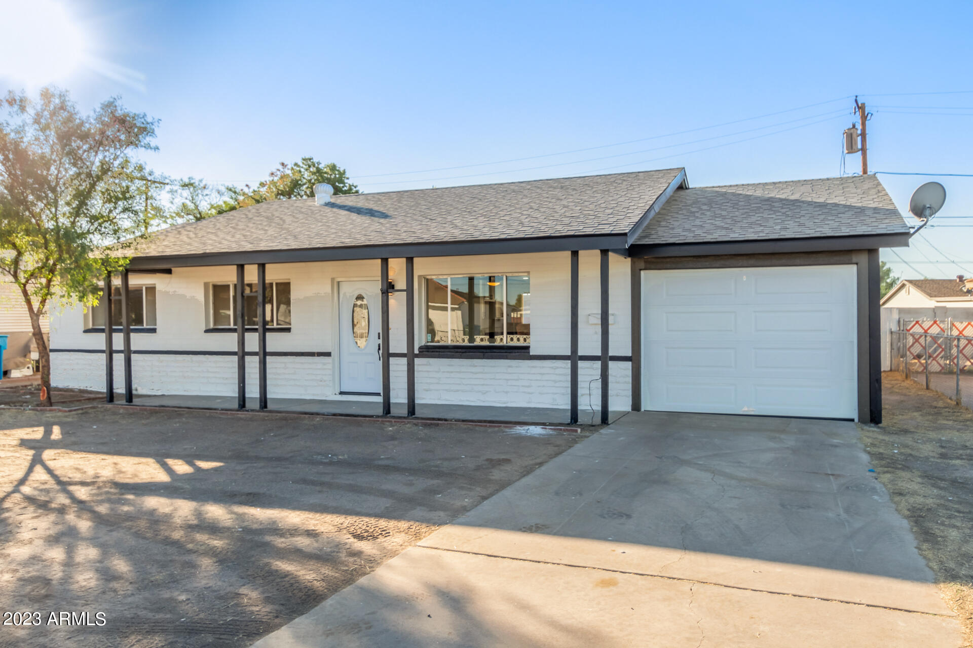 2913 West Charter Oak Road Phoenix, AZ 85029 - Photo 2 of 23 a front view of a house with a yard