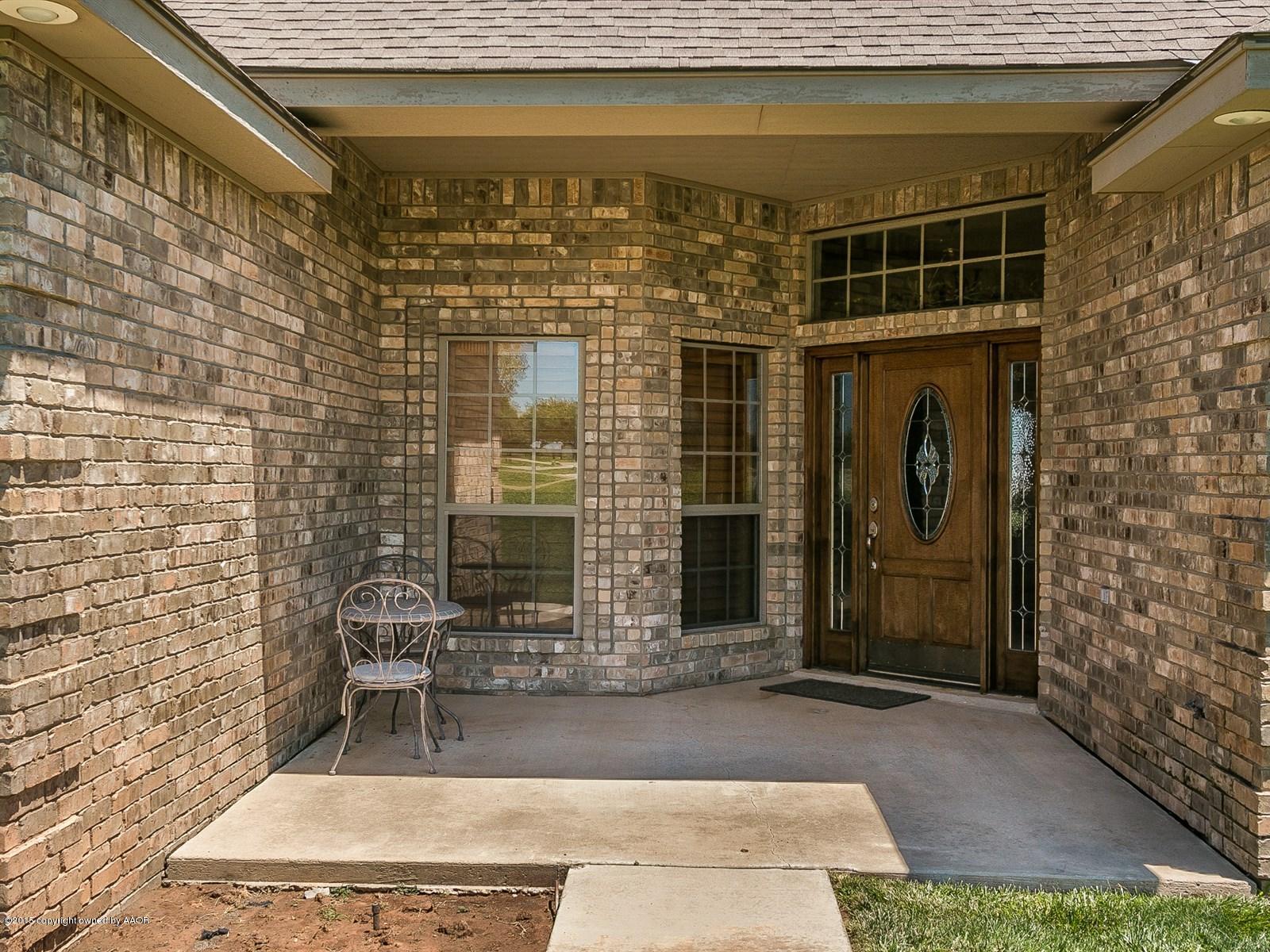 9151 Greyhawk Road Amarillo, TX 79119 - Photo 3 of 31 a front view of a house with outdoor seating