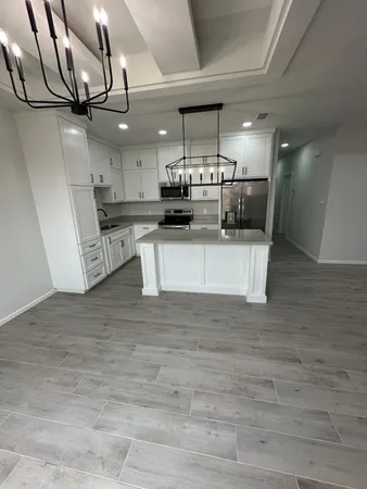 a view of a kitchen with a sink