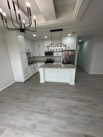 a view of a kitchen with a sink