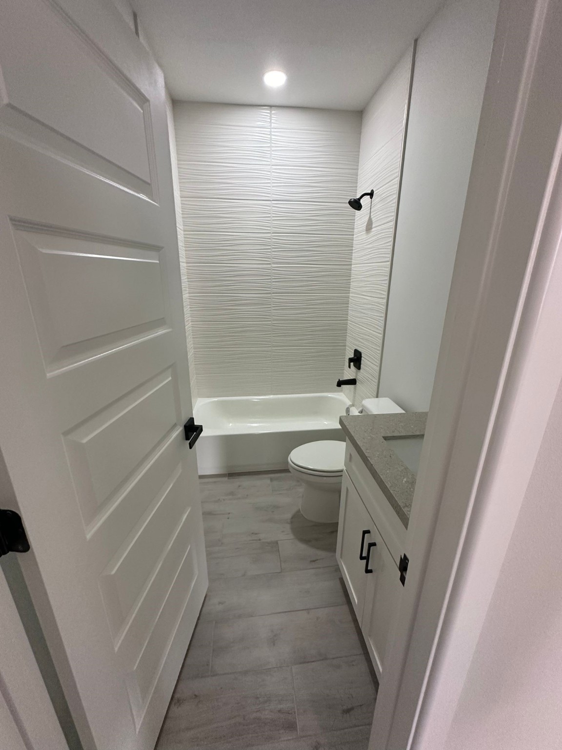 1409 South Xanthia Street Alton, TX 78573 - Photo 7 of 14 a bathroom with a granite countertop sink toilet and shower