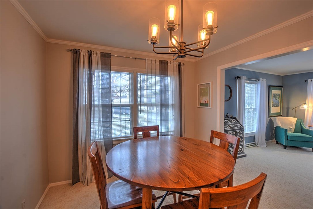 46 Woodhill Court Decatur, IL 62521 - Photo 12 of 32 a dining room with furniture and chandelier fan