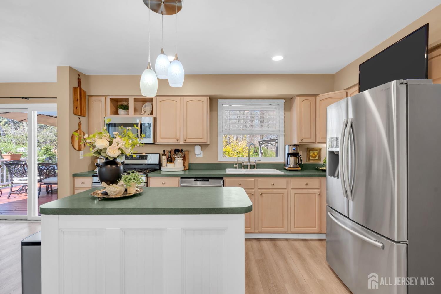 90 Bear Brook Road Princeton, NJ 08540 - Photo 28 of 60 a kitchen with a refrigerator a stove a sink and dishwasher with wooden floor