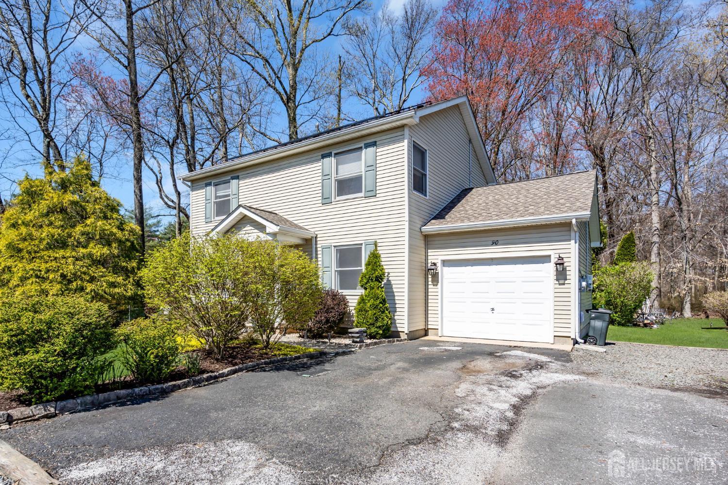 90 Bear Brook Road Princeton, NJ 08540 - Photo 3 of 60 a view of a house with a yard and garage