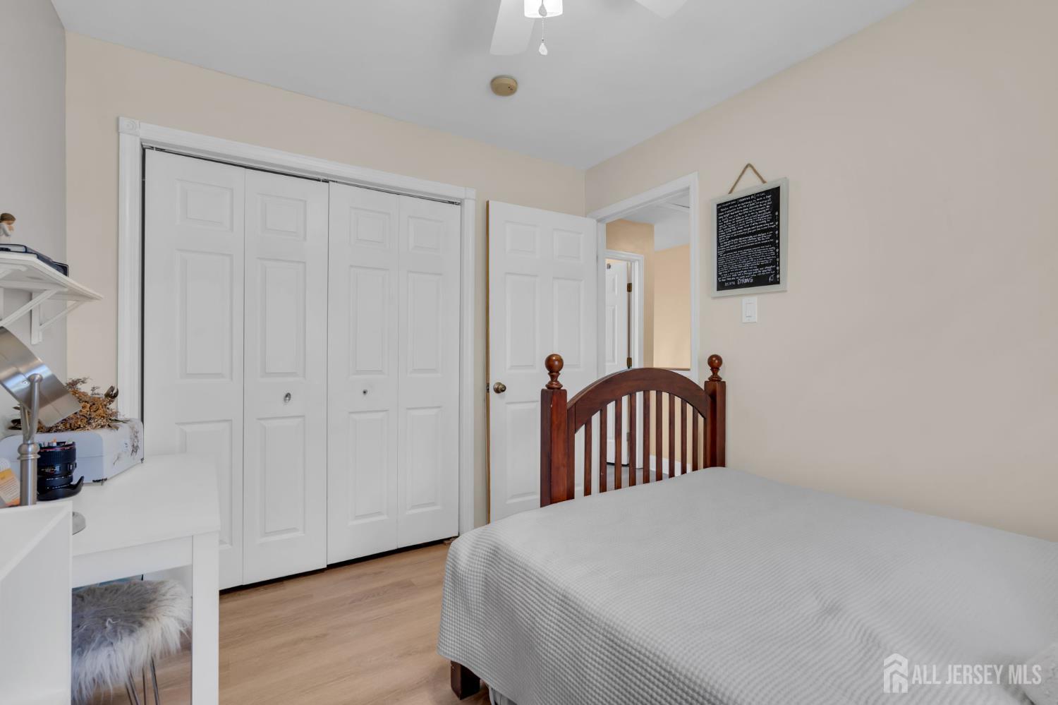 90 Bear Brook Road Princeton, NJ 08540 - Photo 42 of 60 a bedroom with a bed and a chandelier