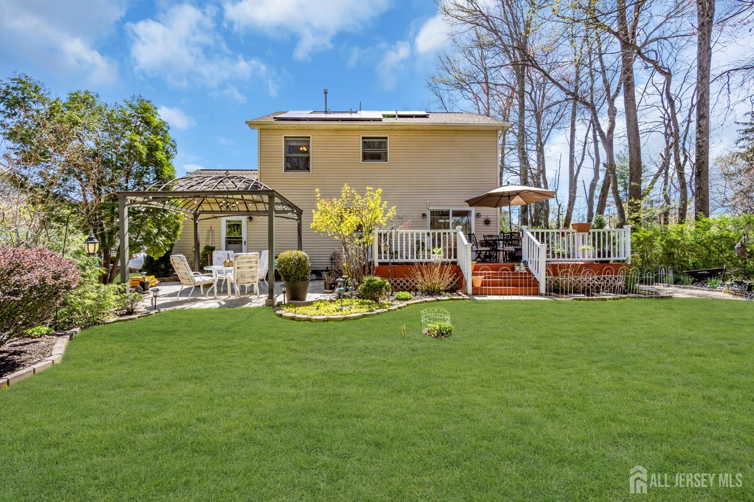 90 Bear Brook Road Princeton, NJ 08540 - Photo 50 of 60 a view of a house with backyard and sitting area