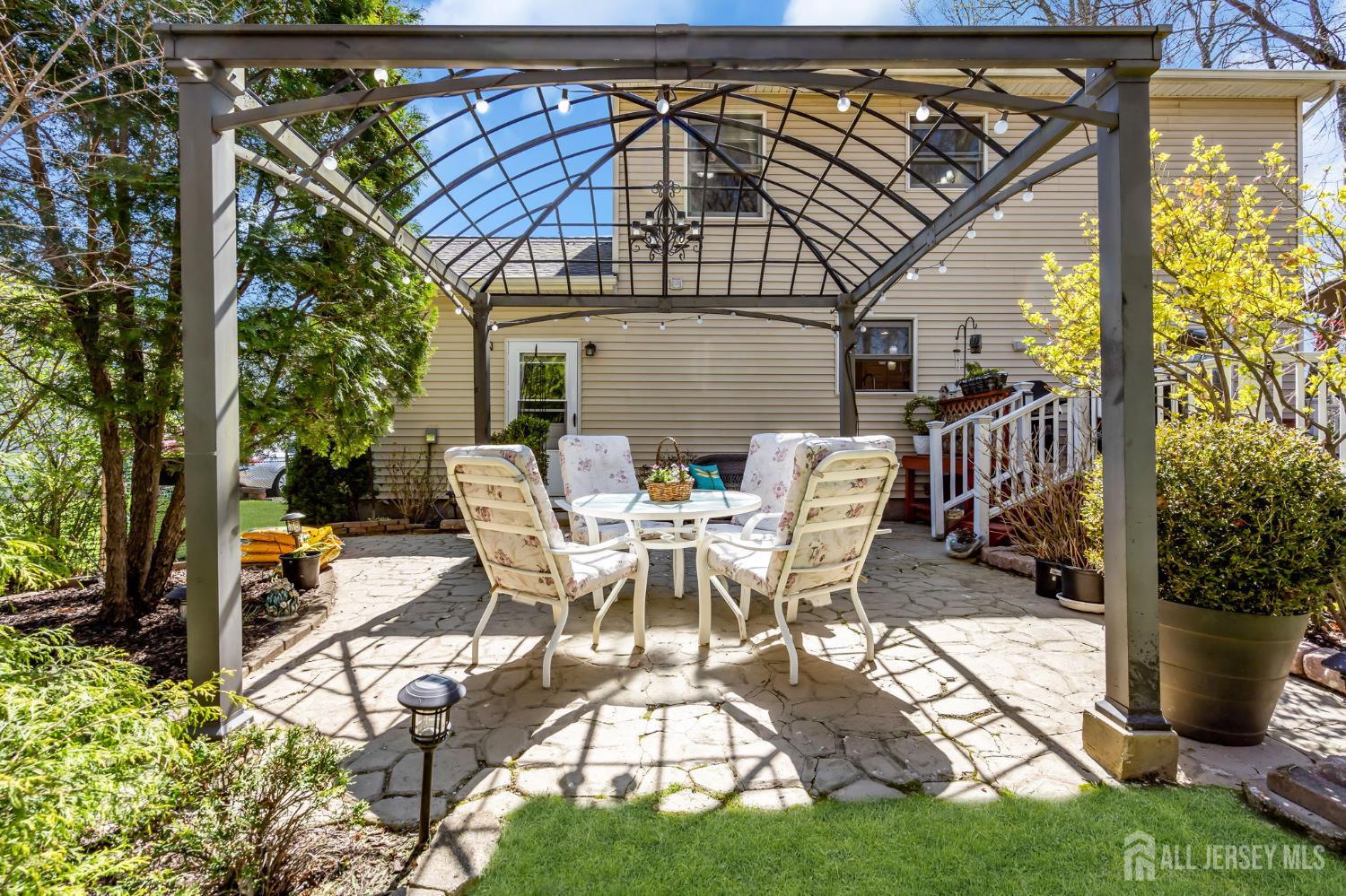 90 Bear Brook Road Princeton, NJ 08540 - Photo 53 of 60 a view of a patio with table and chairs potted plants and large tree
