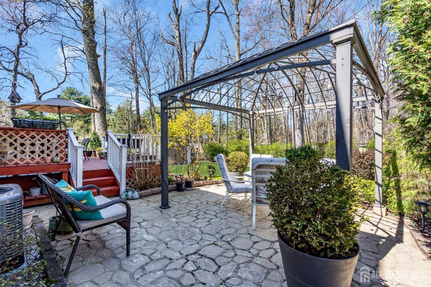 90 Bear Brook Road Princeton, NJ 08540 - Photo 54 of 60 a view of a chairs and table in backyard of the house