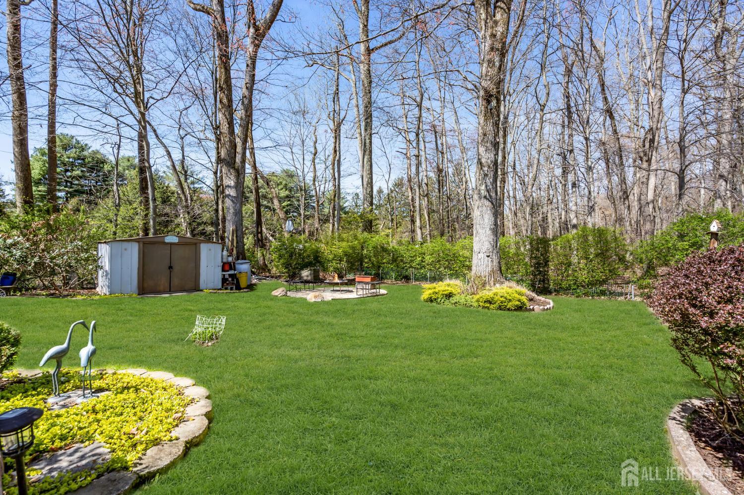 90 Bear Brook Road Princeton, NJ 08540 - Photo 56 of 60 a view of a chair and table and garden in the back