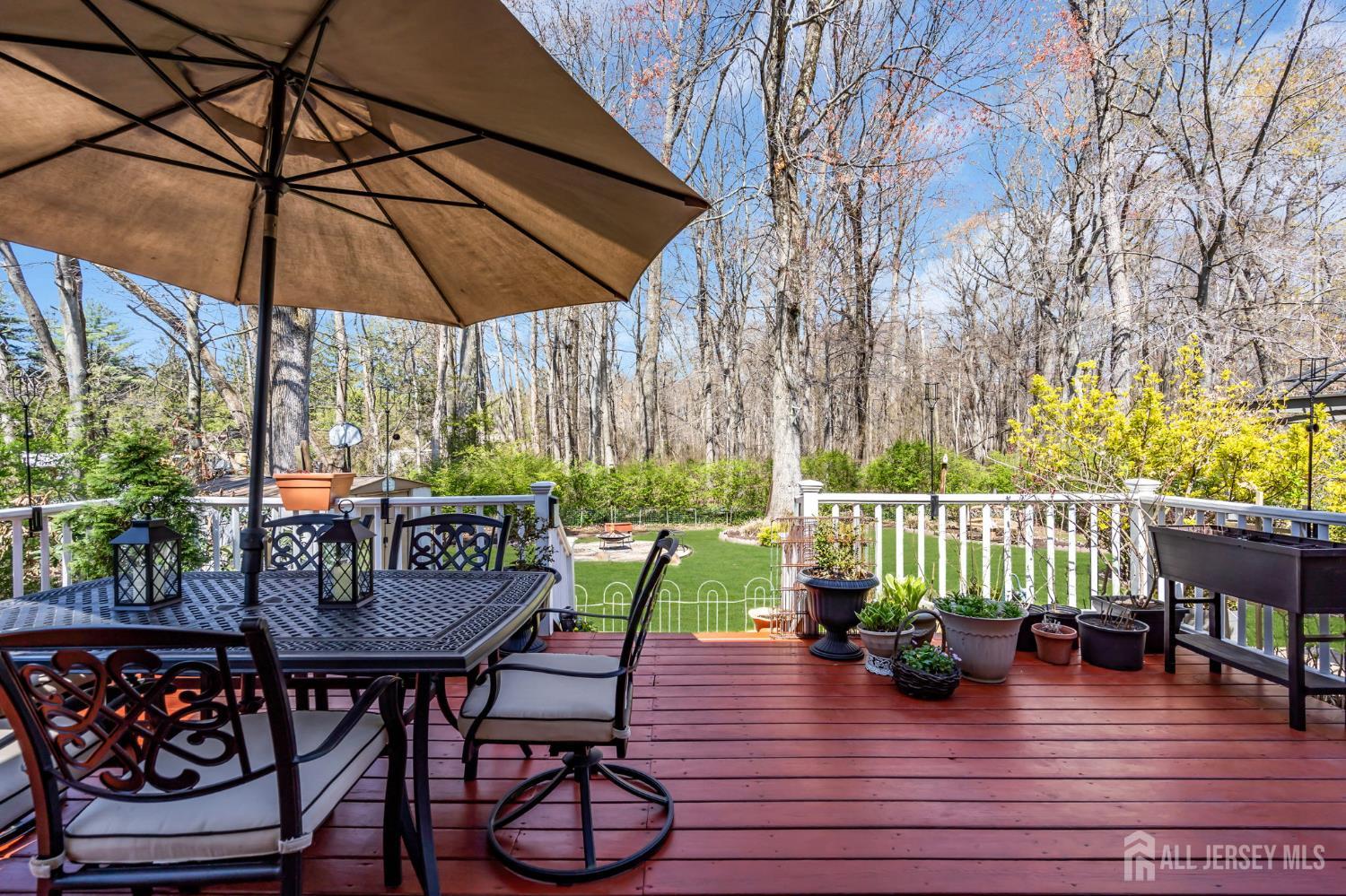 90 Bear Brook Road Princeton, NJ 08540 - Photo 60 of 60 a view of deck with furniture and umbrella