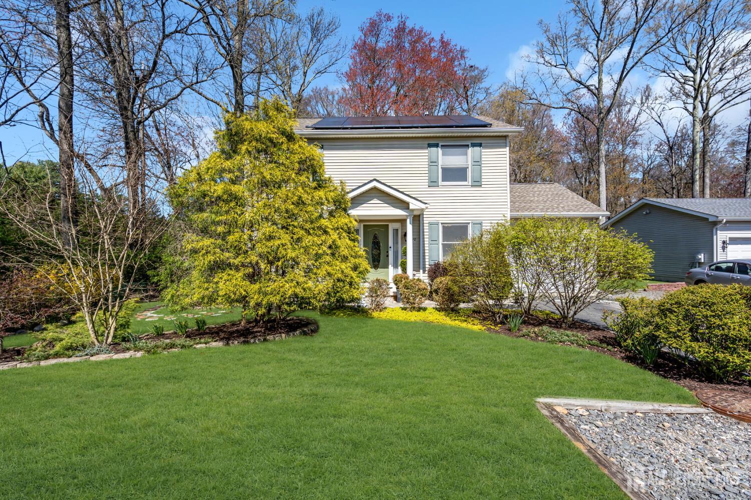 90 Bear Brook Road Princeton, NJ 08540 - Photo 6 of 60 a front view of a house with a garden