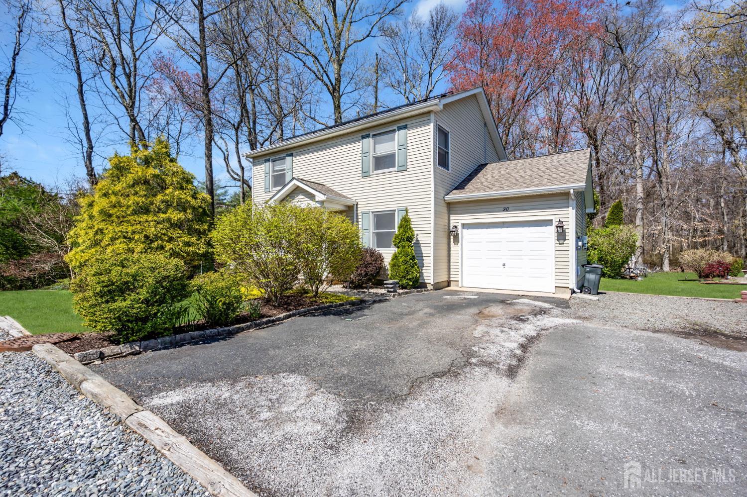 90 Bear Brook Road Princeton, NJ 08540 - Photo 7 of 60 a view of a house with a yard and garage