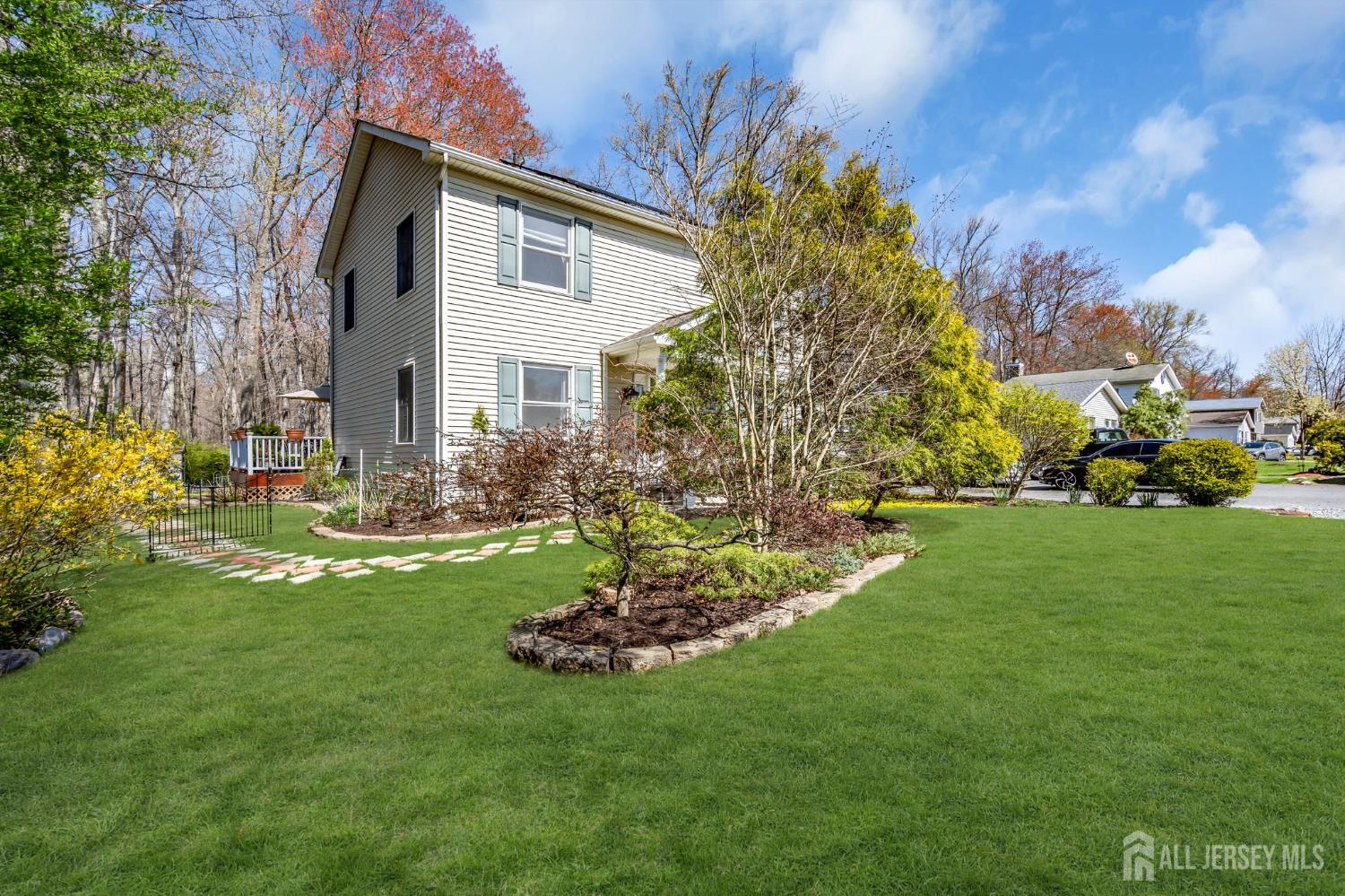 90 Bear Brook Road Princeton, NJ 08540 - Photo 8 of 60 a front view of a house with a garden and trees