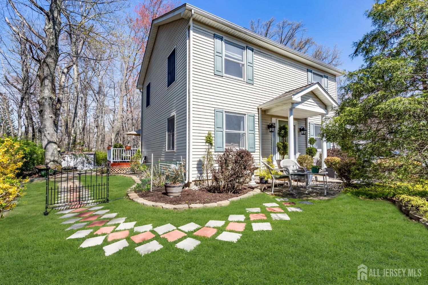 90 Bear Brook Road Princeton, NJ 08540 - Photo 9 of 60 a front view of house with a garden and patio