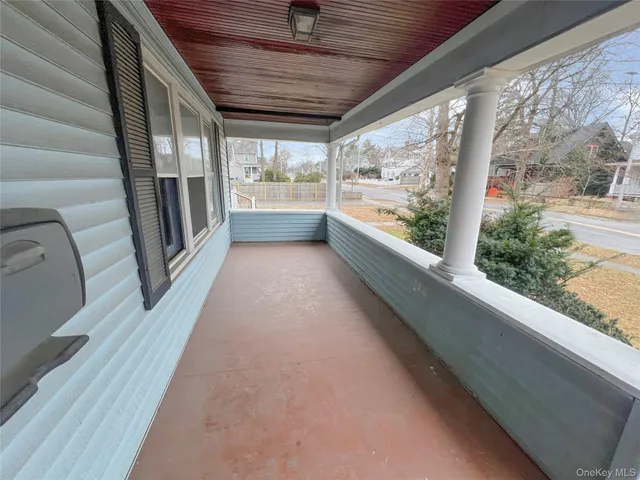 a view of a house with a yard and garage