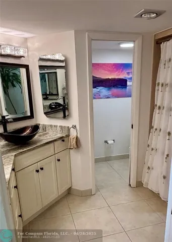 a bathroom with a sink a mirror and a toilet