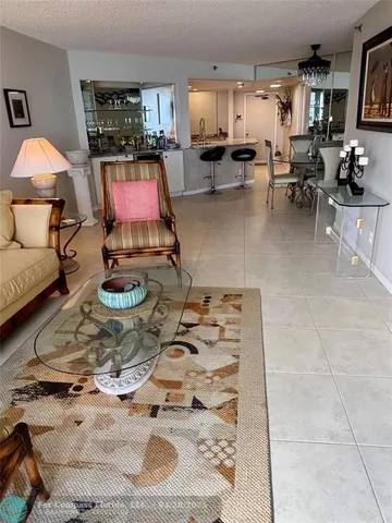 a room with furniture and a flat screen tv