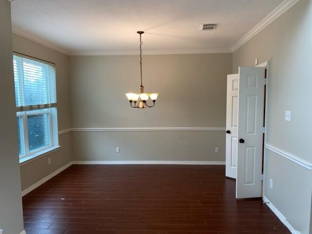 18810 Rusty Anchor Court Humble, TX 77346 - Photo 12 of 26 an empty room with wooden floor cabinet and windows