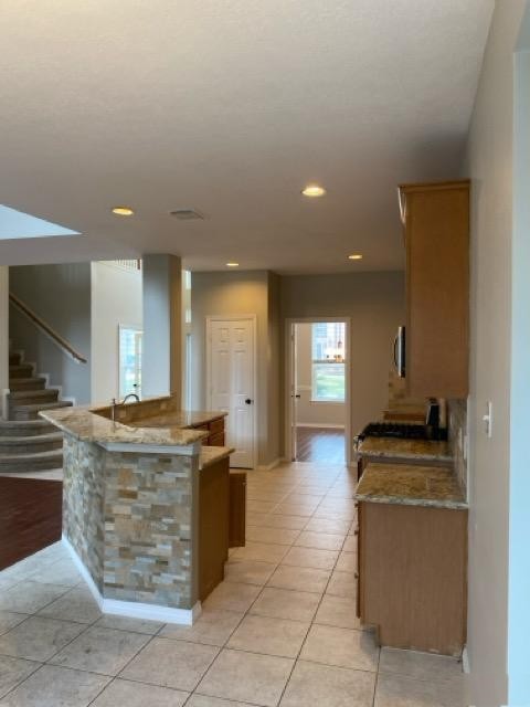 18810 Rusty Anchor Court Humble, TX 77346 - Photo 17 of 26 a kitchen with stainless steel appliances granite countertop a stove and a sink