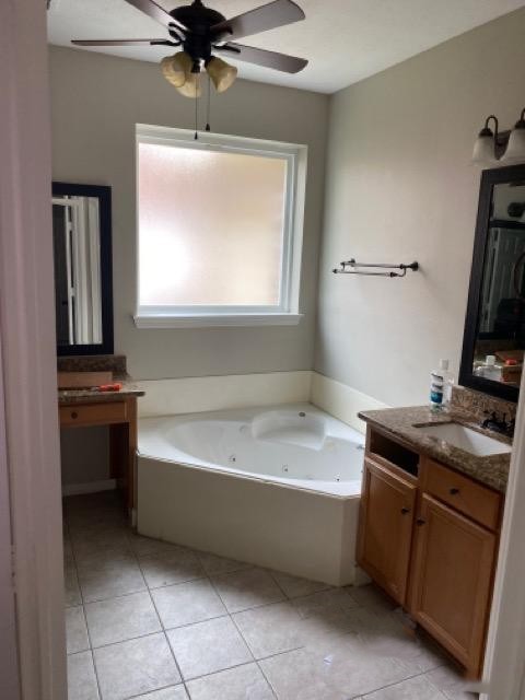 18810 Rusty Anchor Court Humble, TX 77346 - Photo 22 of 26 a bathroom with a tub sink and a mirror