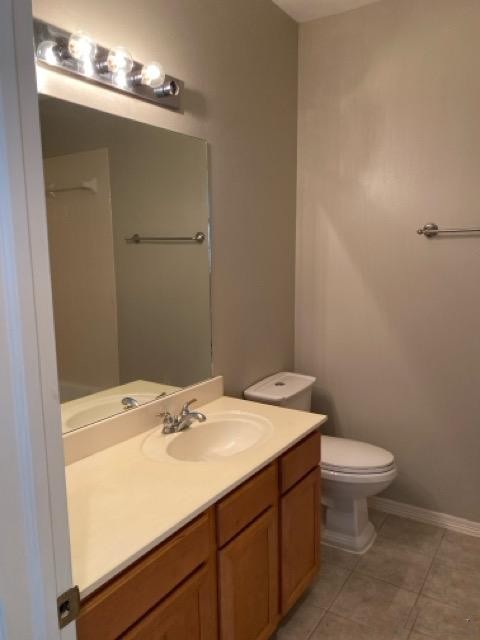 18810 Rusty Anchor Court Humble, TX 77346 - Photo 25 of 26 a bathroom with a sink toilet and a mirror