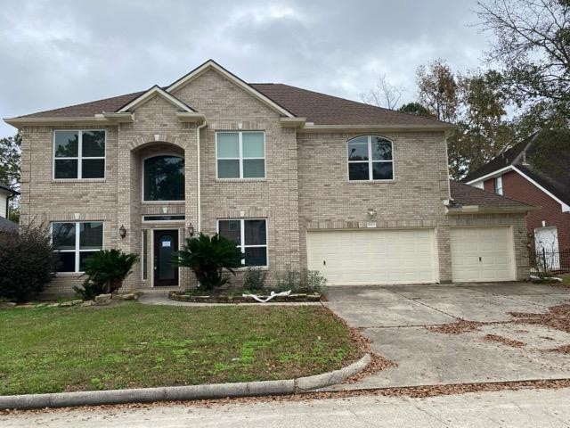 18810 Rusty Anchor Court Humble, TX 77346 - Photo 3 of 26 a front view of a house with a yard