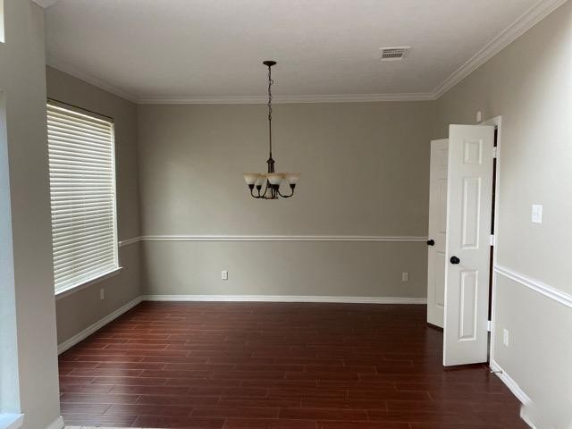 18810 Rusty Anchor Court Humble, TX 77346 - Photo 6 of 26 a view of a room with wooden floor and white walls