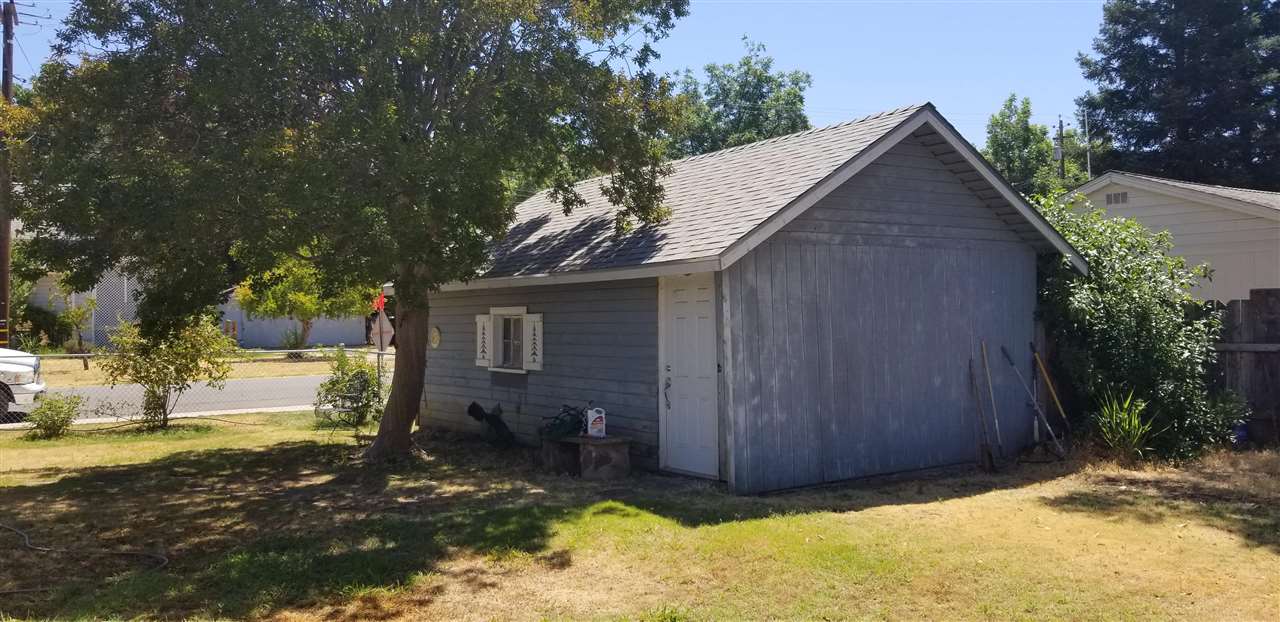 381 Aleut Street Biggs, CA 95917 - Photo 9 of 35 a view of a house with backyard and trees