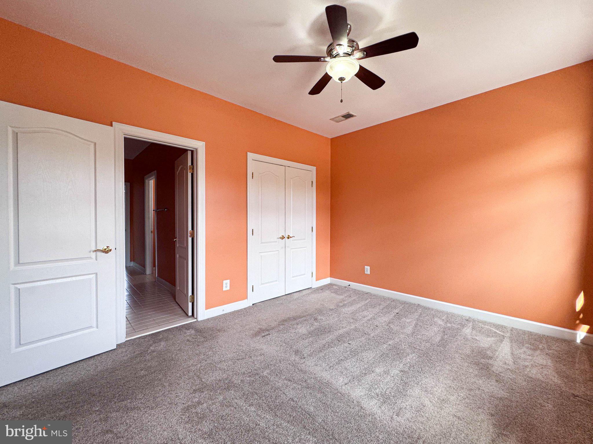 22827 Oakgrove Road Sterling, VA 20166 - Photo 15 of 56 Vibrant orange walls invite creativity.