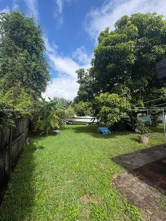 a backyard of a house with lots of green space