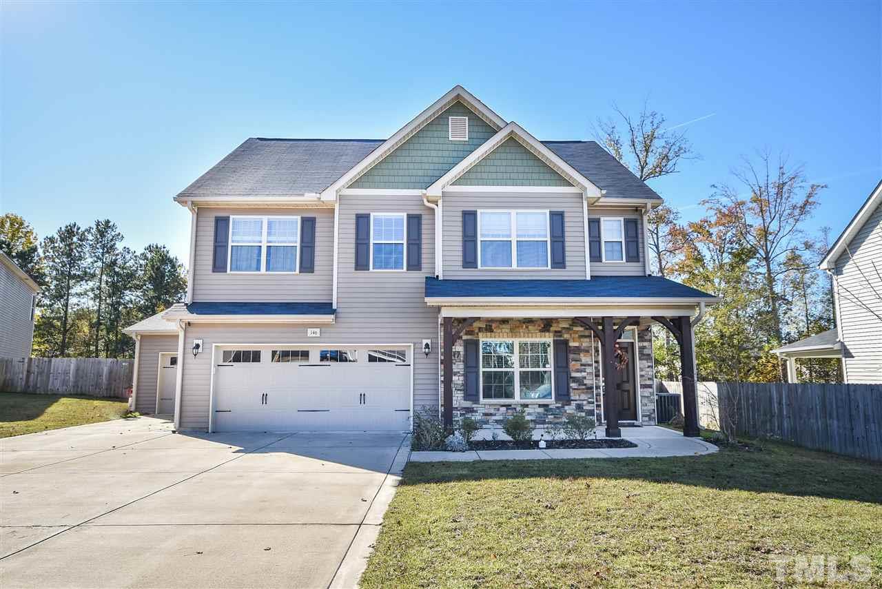 146 Shellbark Drive Spring Lake, NC 28390 - Photo 1 of 25 a front view of a house with a yard