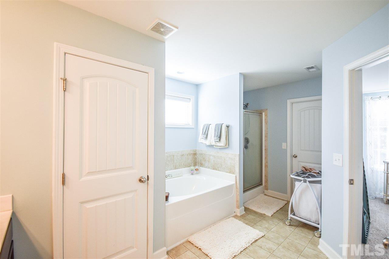 146 Shellbark Drive Spring Lake, NC 28390 - Photo 12 of 25 a bathroom with a bathtub and a sink