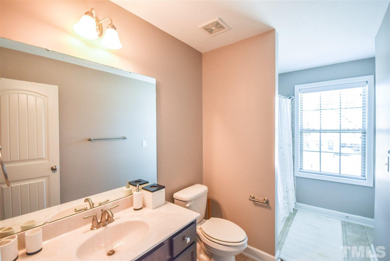 146 Shellbark Drive Spring Lake, NC 28390 - Photo 14 of 25 a bathroom with a sink a toilet and shower