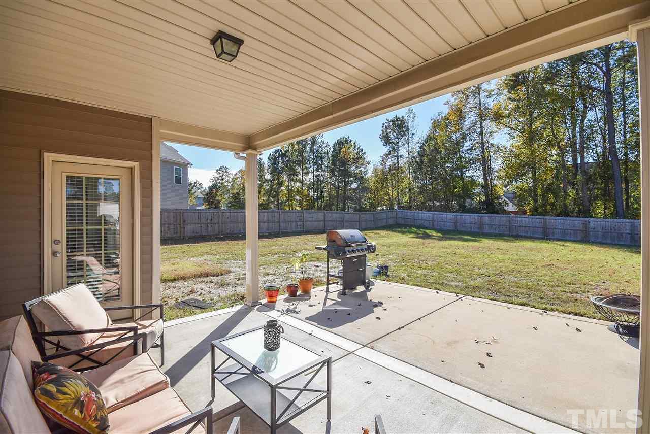 146 Shellbark Drive Spring Lake, NC 28390 - Photo 20 of 25 a view of a chairs and table in the patio and a swimming pool