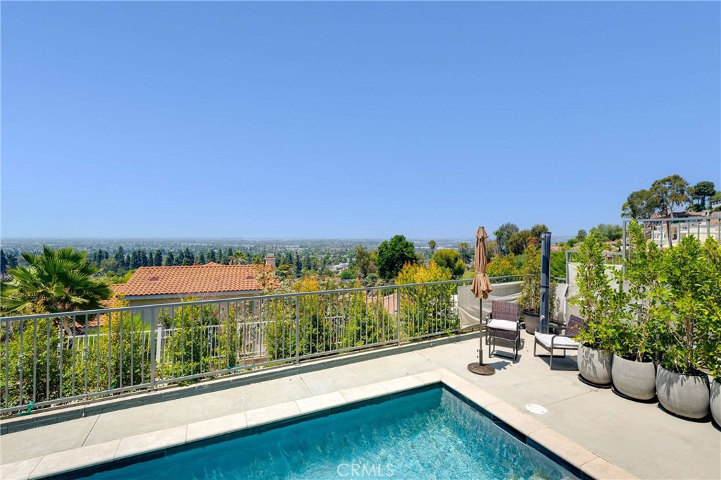 11837 Rideout Way Whittier, CA 90601 - Photo 36 of 44 a view of a swimming pool with furniture