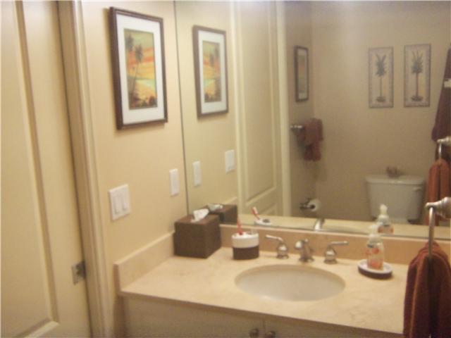 99 Southeast Mizner Boulevard, Unit 533 Boca Raton, FL 33432 - Photo 12 of 14 a bathroom with a sink and a mirror
