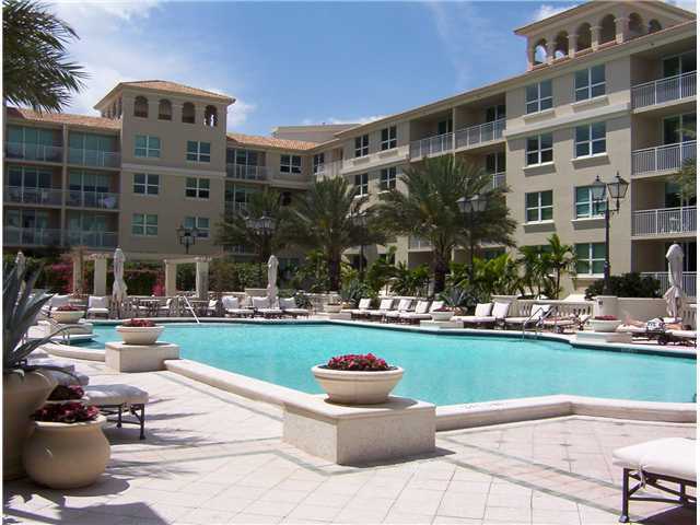 99 Southeast Mizner Boulevard, Unit 533 Boca Raton, FL 33432 - Photo 14 of 14 a front view of building with outdoor seating and yard