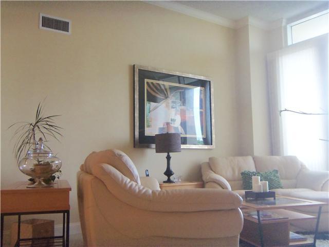 99 Southeast Mizner Boulevard, Unit 533 Boca Raton, FL 33432 - Photo 4 of 14 a living room with furniture and a window