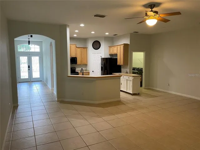 a view of a kitchen with a sink and cabinets