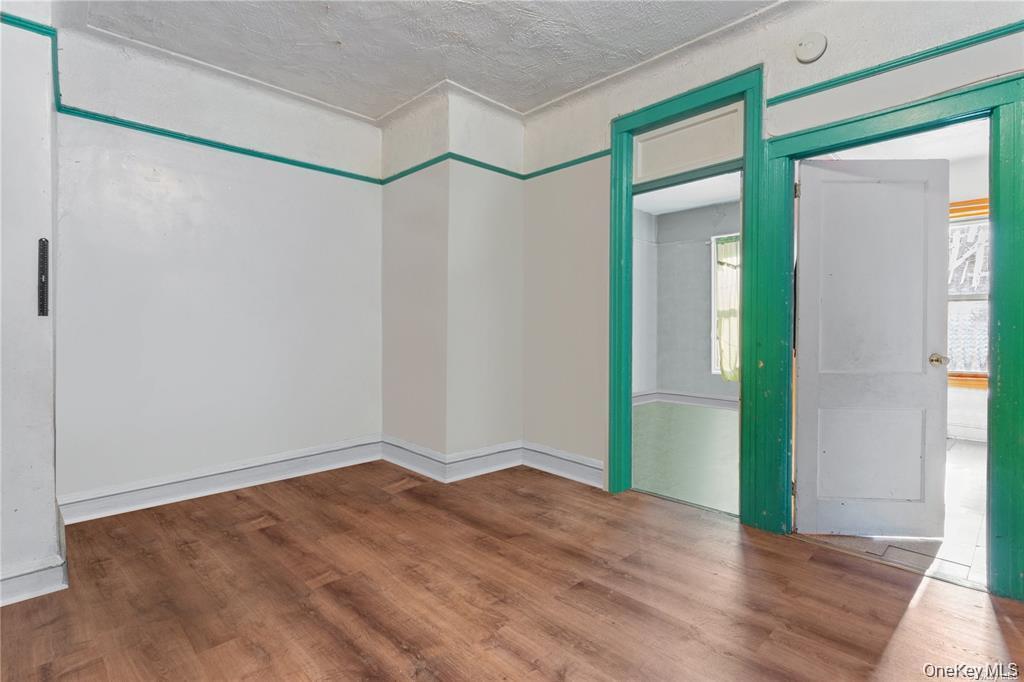 97-28 41st Avenue Queens, NY 11368 - Photo 12 of 29 wooden floor in an empty room