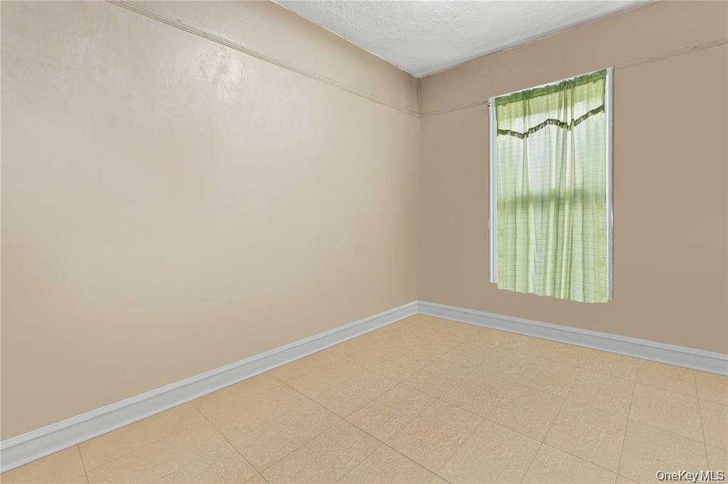 97-28 41st Avenue Queens, NY 11368 - Photo 17 of 29 an empty room with a window
