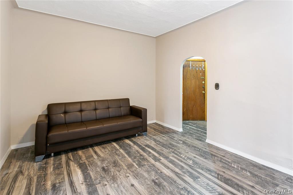97-28 41st Avenue Queens, NY 11368 - Photo 2 of 29 a living room with a couch and a wooden floor